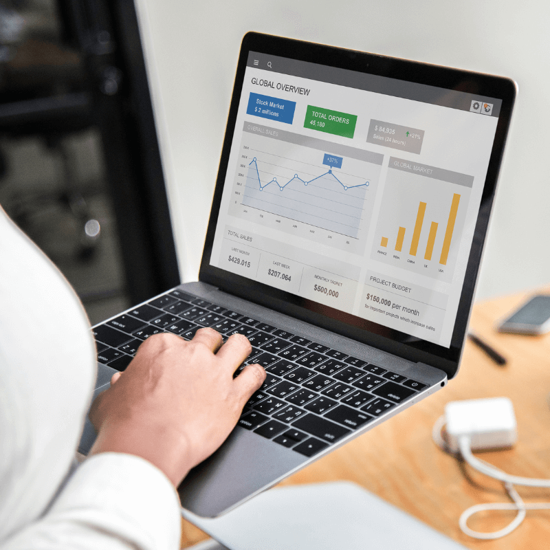 business woman tracking web analytics on macbook business woman tracking web analytics on macbook