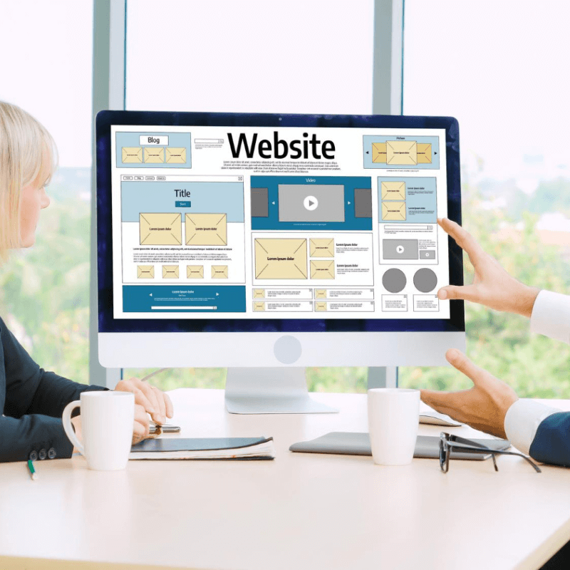 discovery meeting with client, discussing web design layout